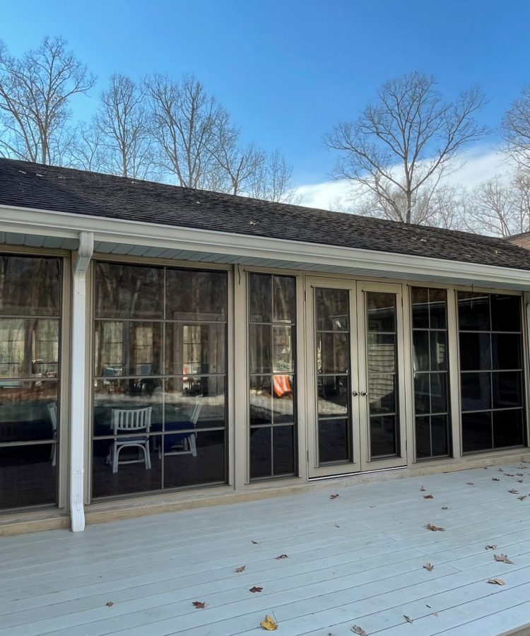 After photo showing porch enclosure with beige Oasis 4-Track panels and French-style doors in Virginia.