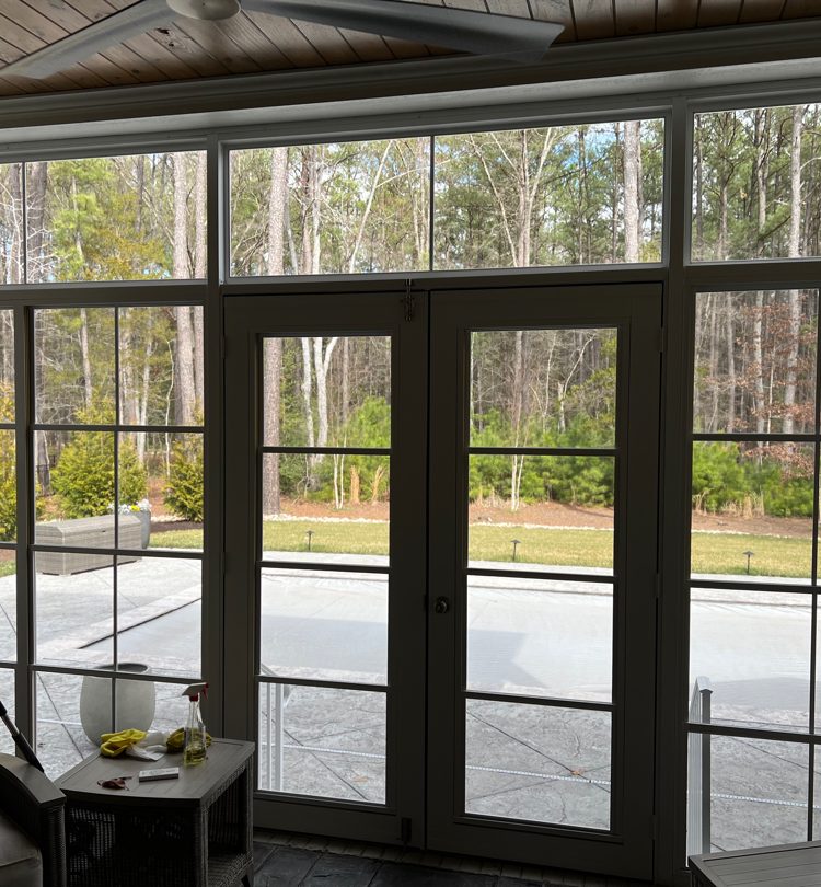 After photo showing enclosed porch with white Oasis 4-Track panels installed by Turnkey Porch Enclosures in Richmond, VA.